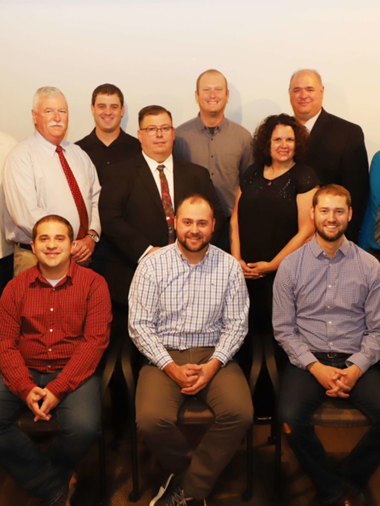 a group photo of Claims Associate Property Adjusters at an event